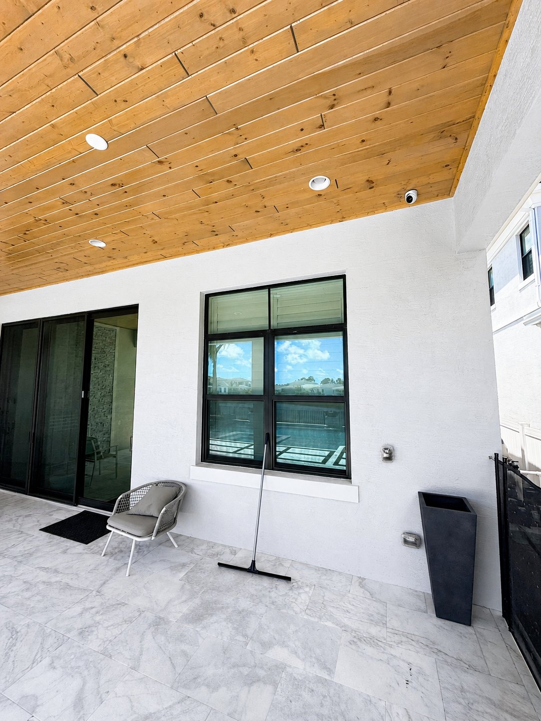 Residential security camera installation on a modern South Florida home patio